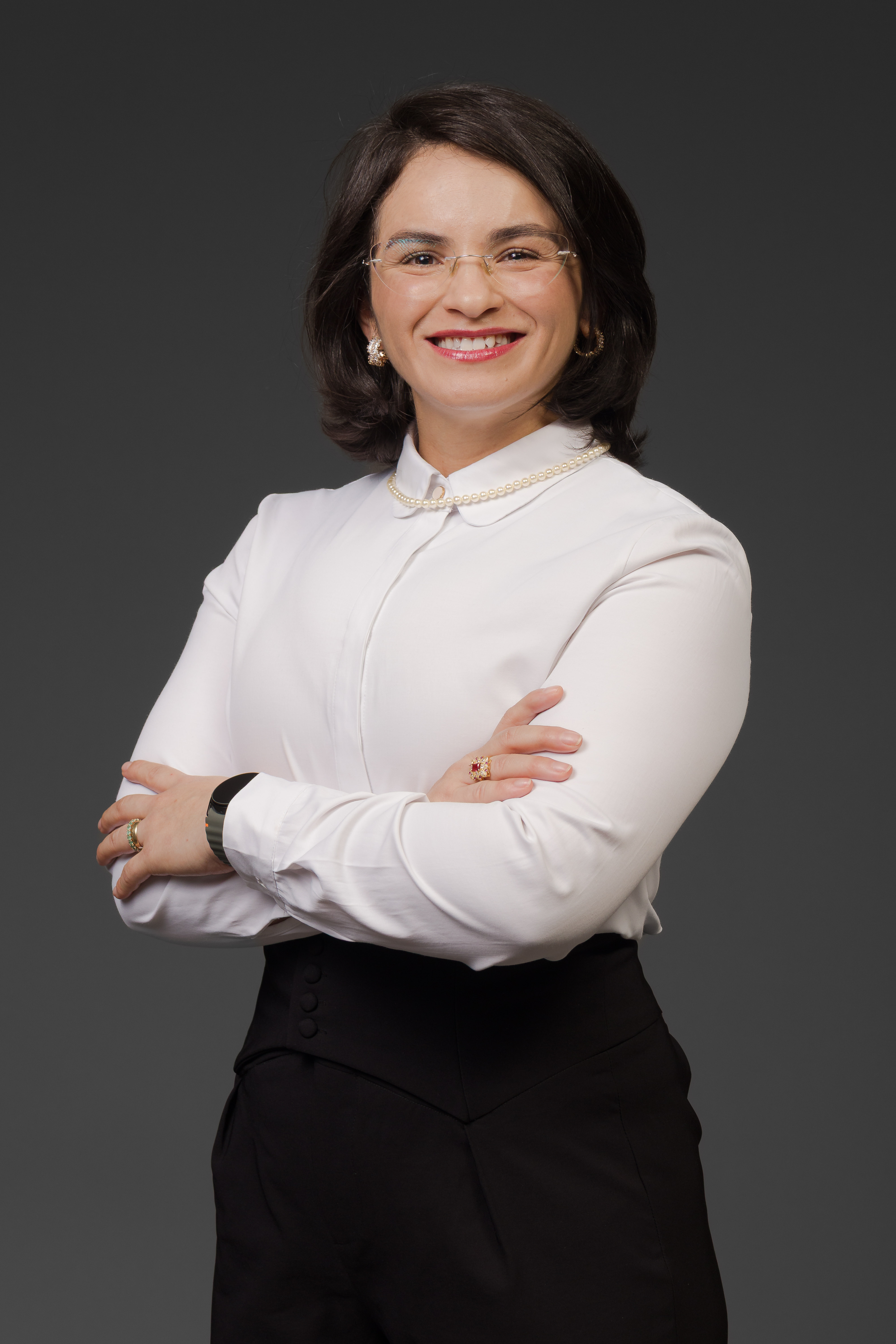 Patrícia Mendes, Terapeuta Ocupacional em seu consultório em Londrina realizando atendimento especializado.